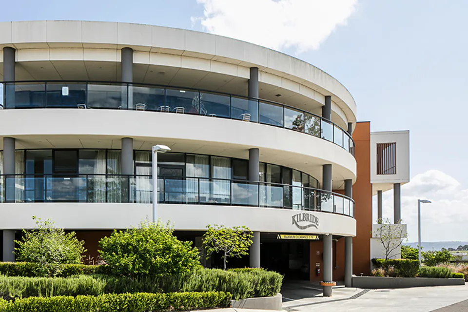 Curved multi-storey building with broad windows