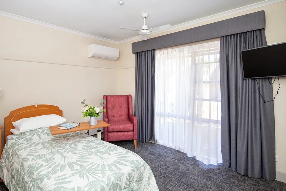 Bedroom with a single bed and bedside table
