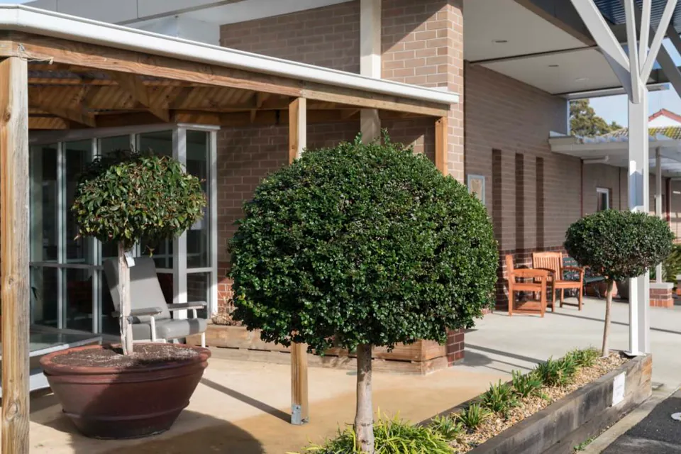 Courtyard entrance beside a brick wall