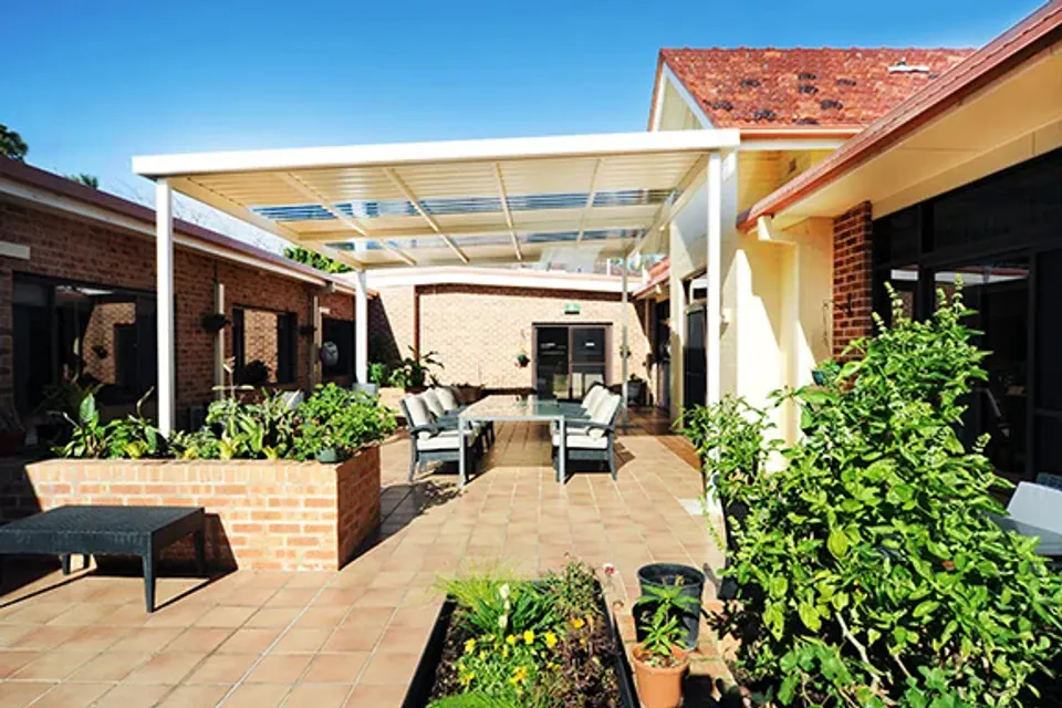 Covered patio with garden beds