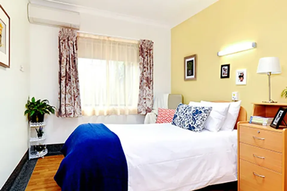 Bedroom with a double bed and bedside table