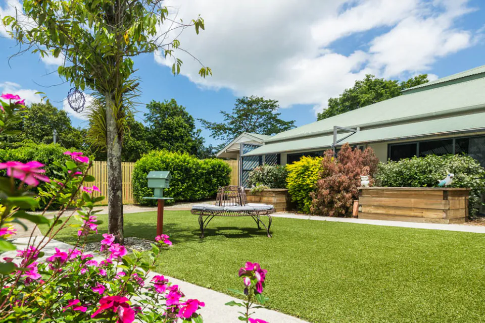 Residence entrance beside landscaped gardens