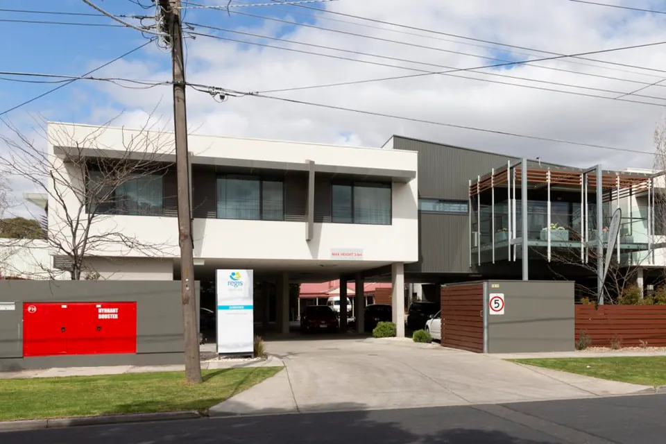Front of the residence with a glass entrance canopy