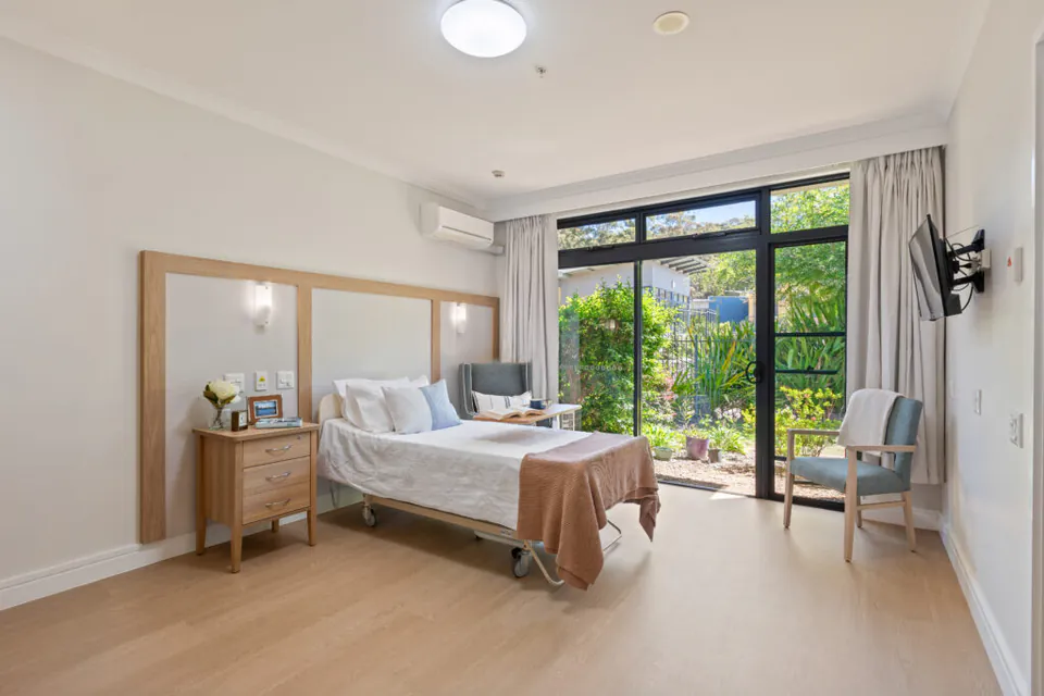 Bedroom with garden-facing glass doors
