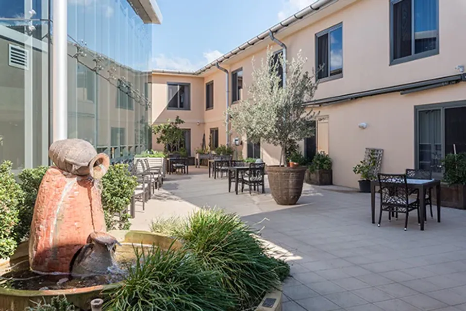 Courtyard with a sculpture and seating
