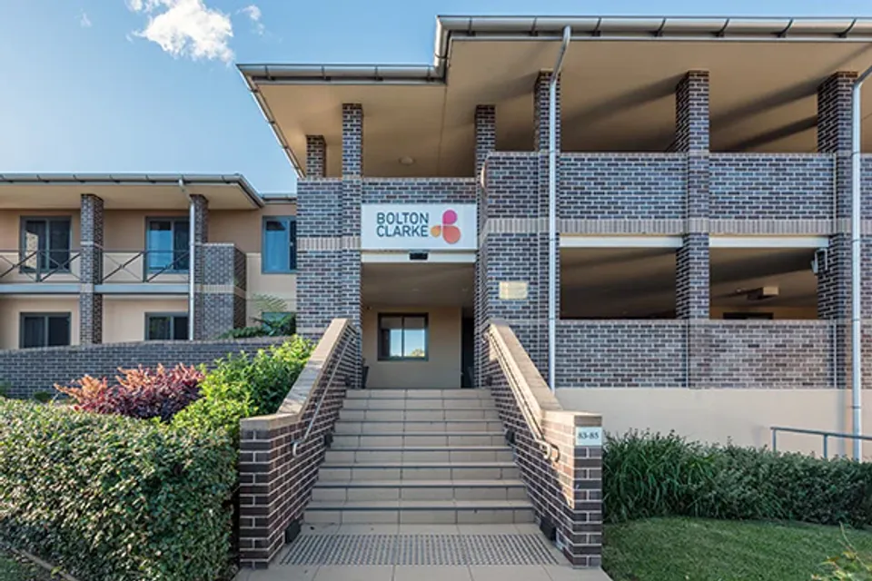 Front entrance with a freestanding sign