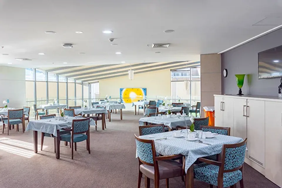 Tables set in a spacious dining room