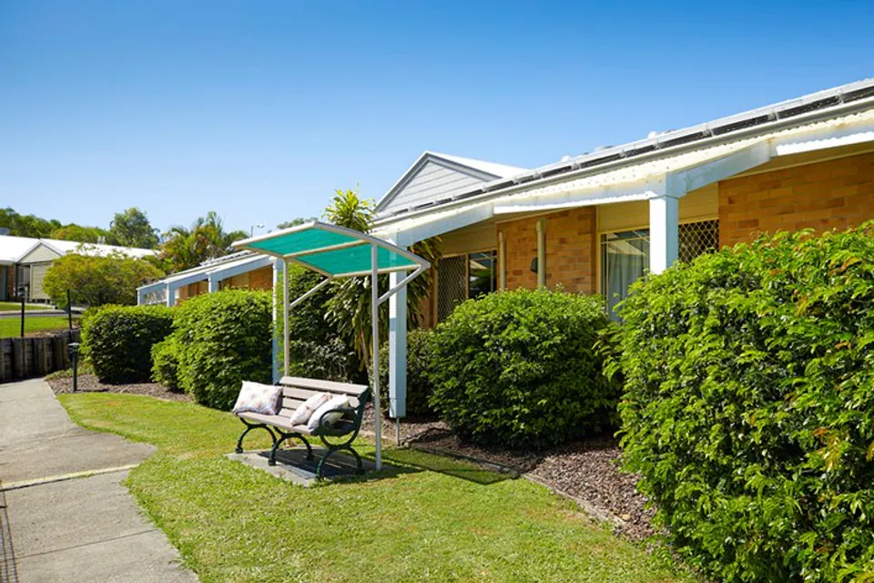Brick residence exterior beside a garden path