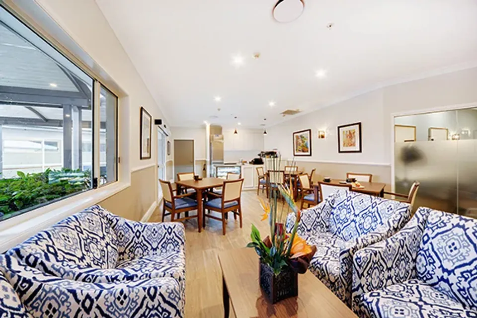 Sitting and dining area with patterned armchairs