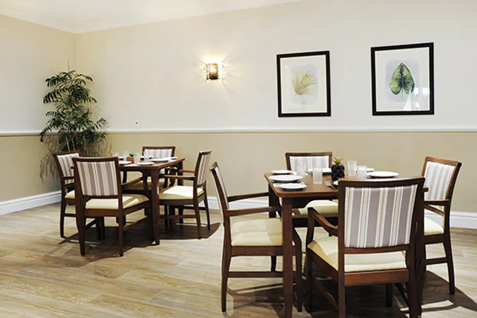 Small dining tables set for meals