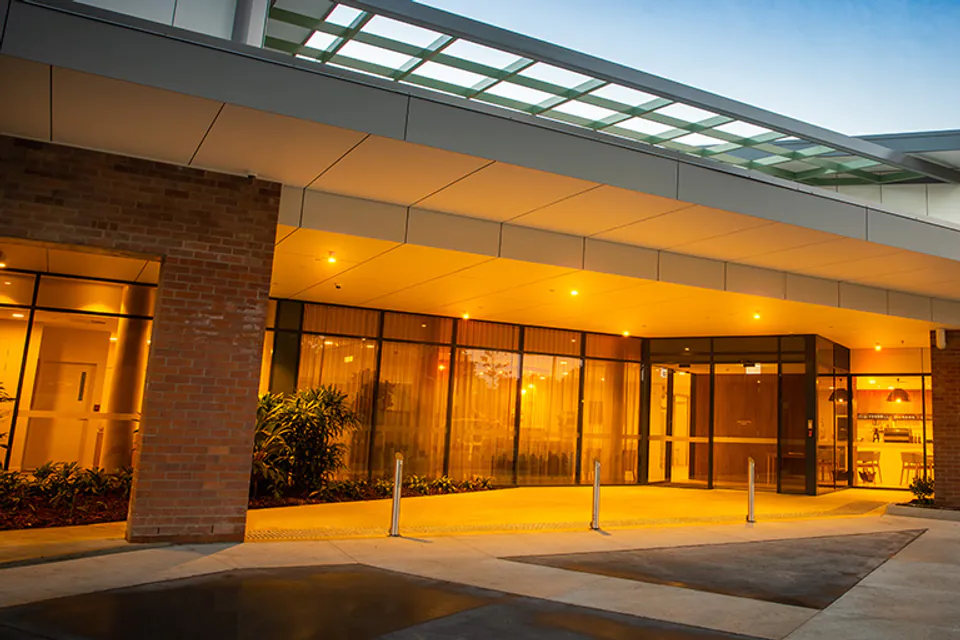Glass-fronted entrance lit at dusk