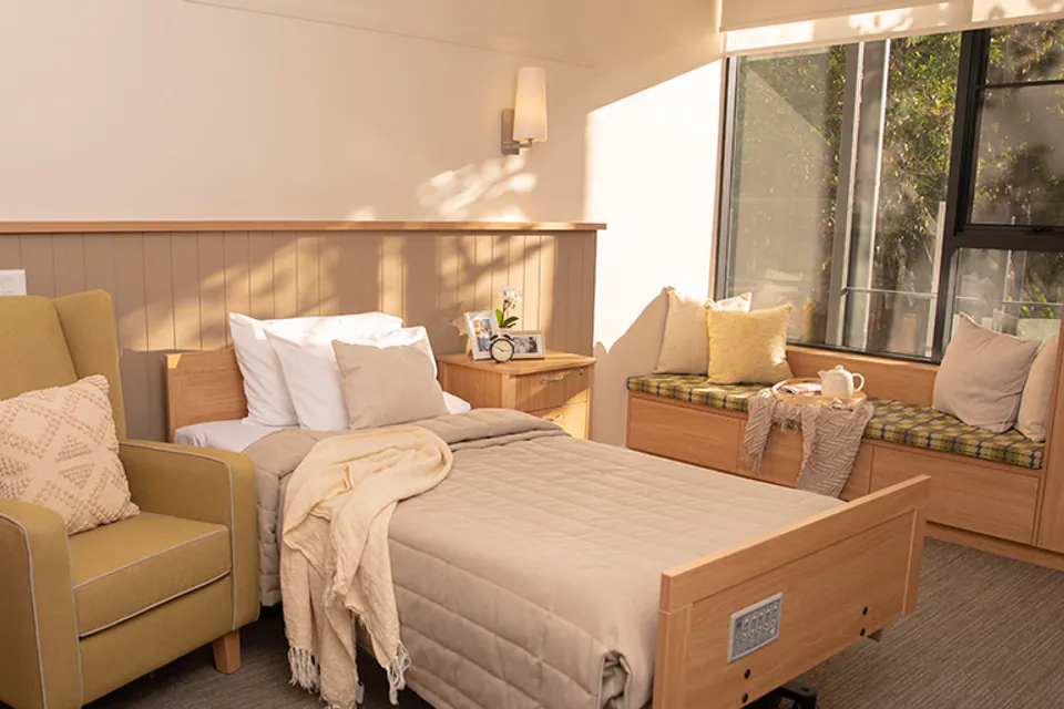 Bedroom with a single bed and sofa