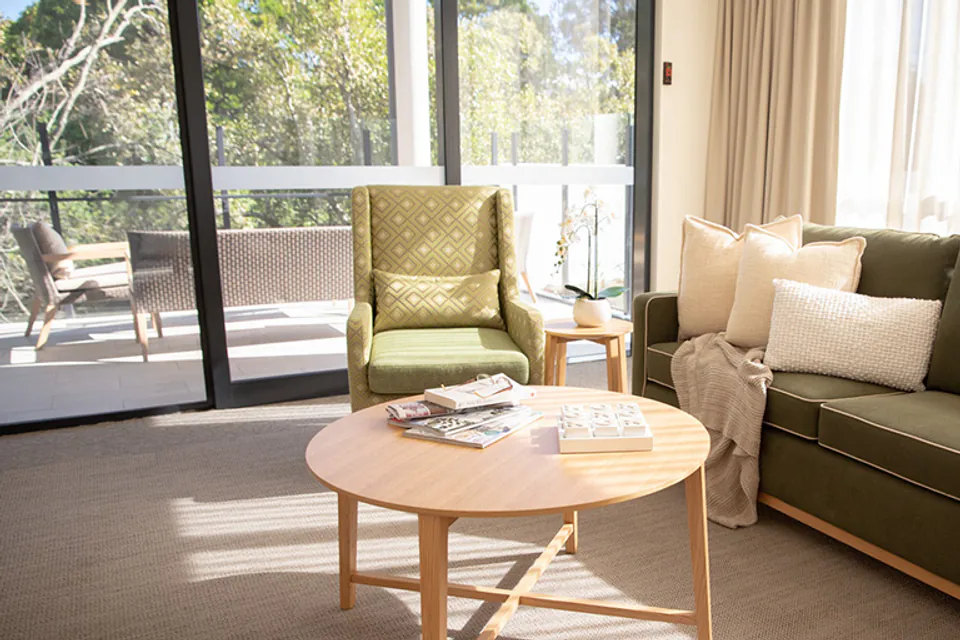 Lounge with sofas beside large windows