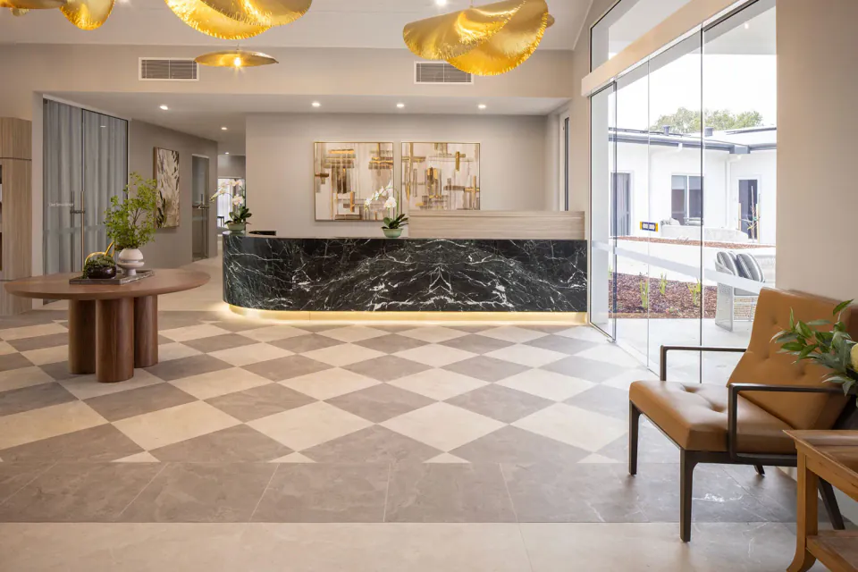 Entrance foyer with reception desk and pendant lights