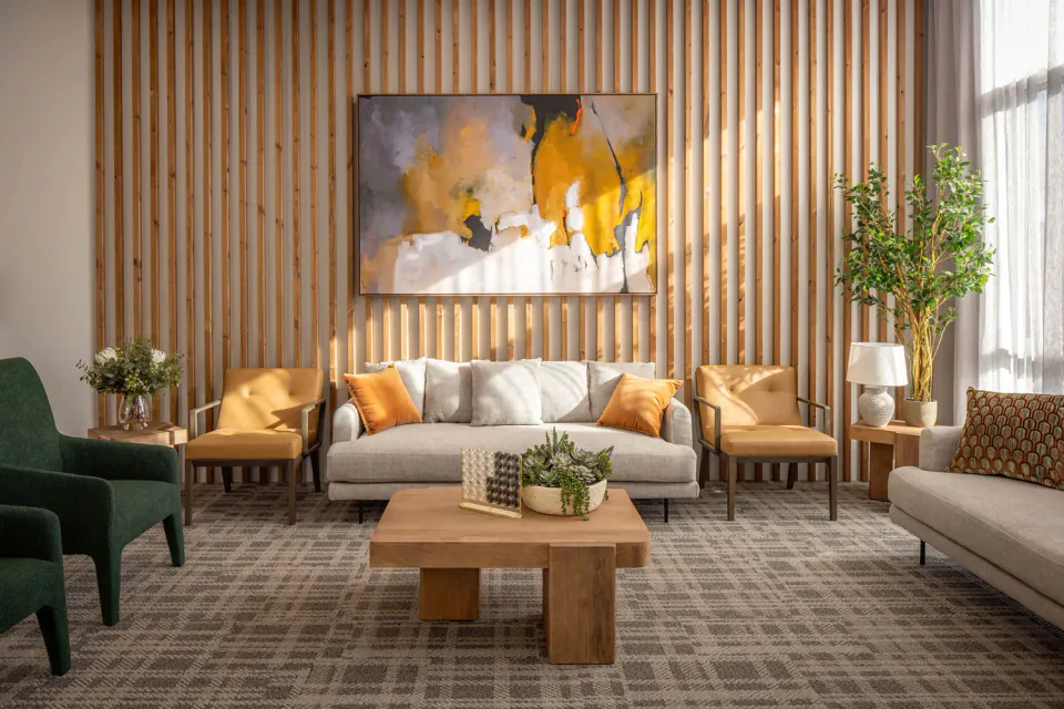 Lounge with sofas against a timber slat wall