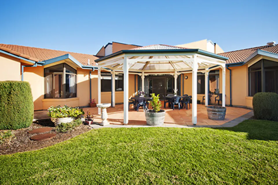 Courtyard gazebo among garden beds