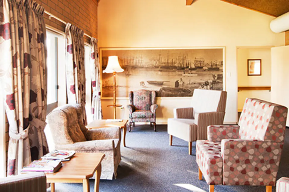 Armchairs and sofa in a sunlit lounge