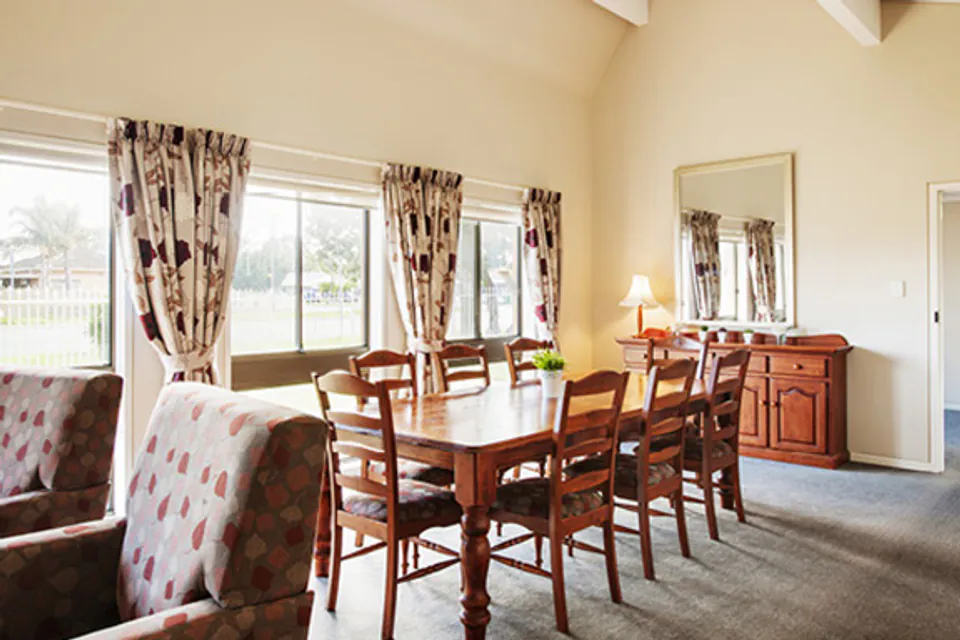 Dining table beside windows