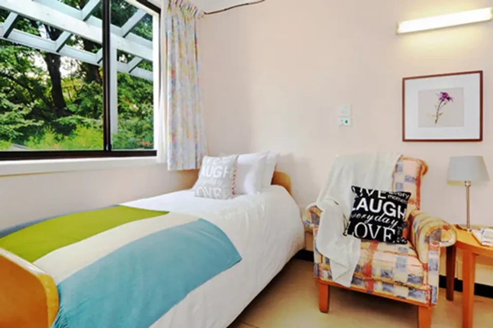 Single bedroom with an armchair