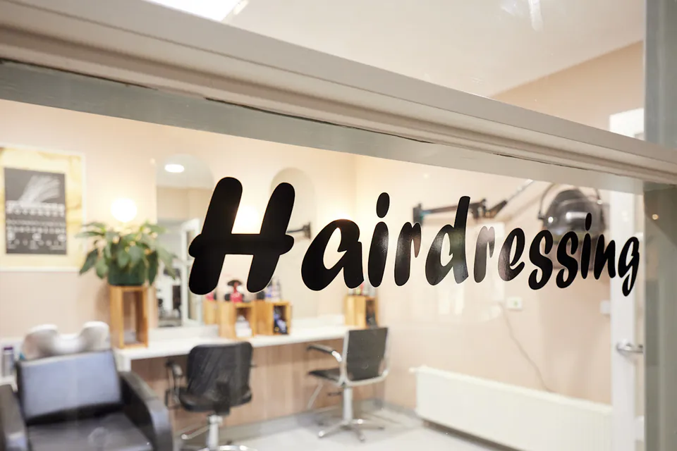 Hair salon with chairs and wash basin