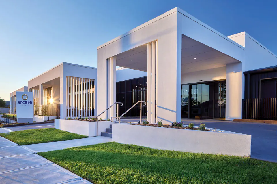 Exterior entrance of the residence at dusk