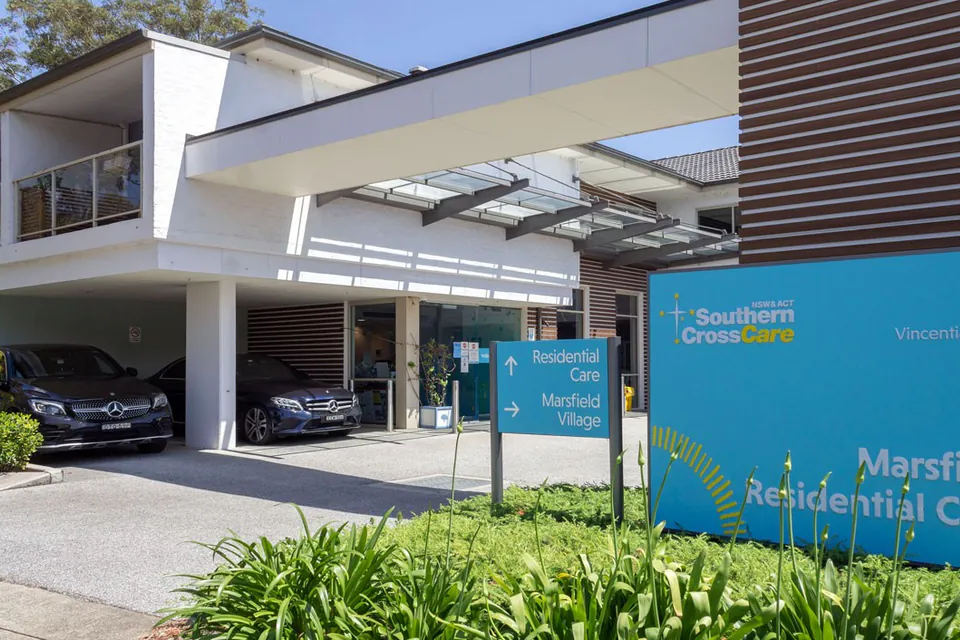 Entrance canopy and blue sign at the residence