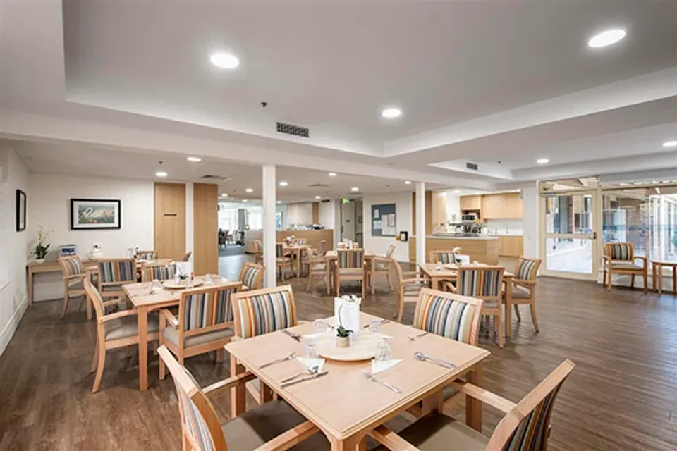 Dining tables set in an open communal room