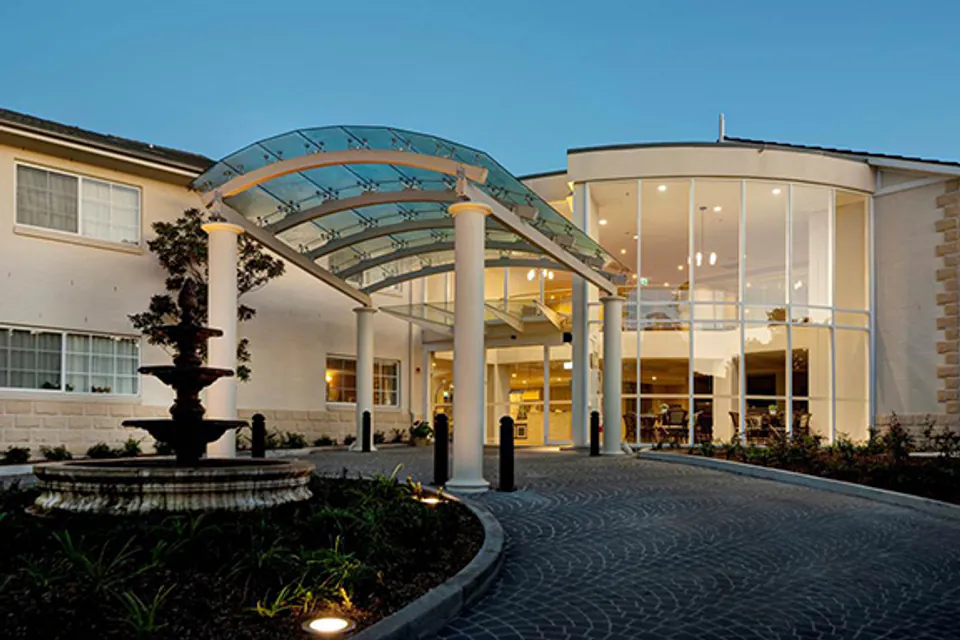 Covered residence entrance at dusk