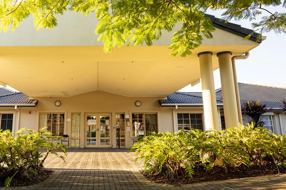 Entrance beneath a broad curved canopy