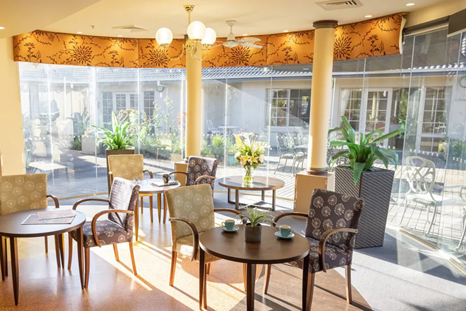 Dining tables beside garden windows