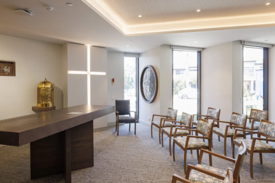 Chapel seating beside tall windows