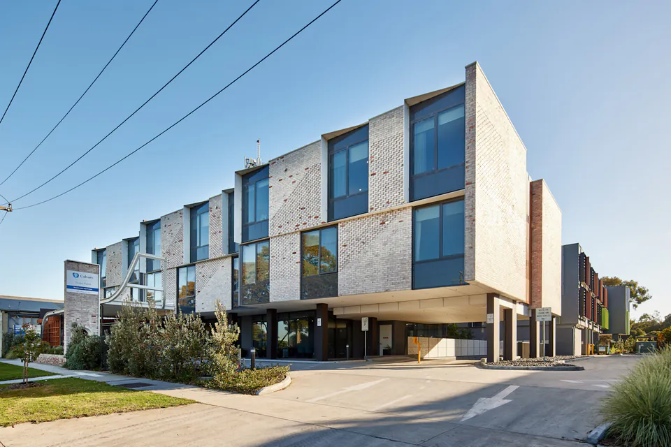 Modern three-storey care building with covered entrance