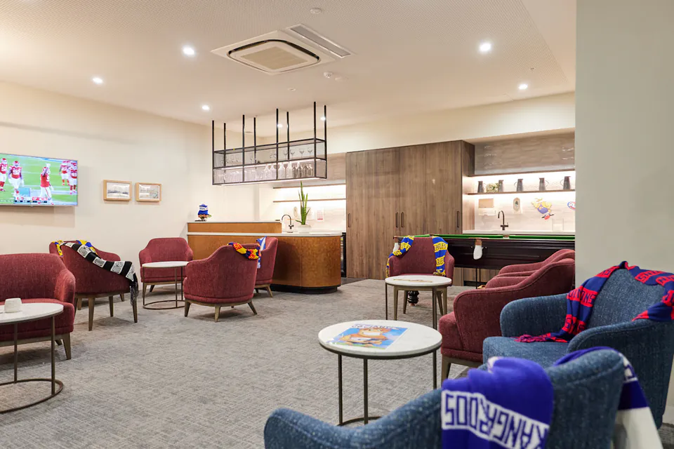 Lounge with armchairs and a television