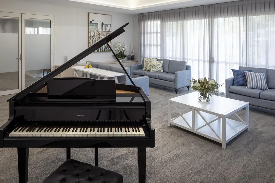 Grand piano in a lounge with sofas