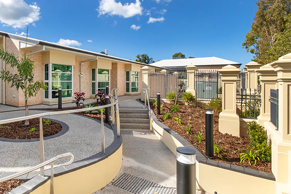 Landscaped garden path between building wings