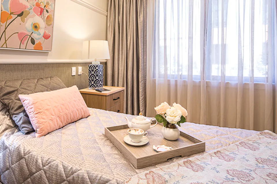 Bedroom with a pink bedspread