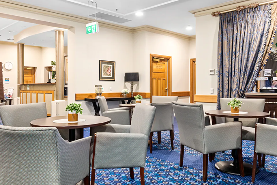 Dining lounge with upholstered chairs and tables