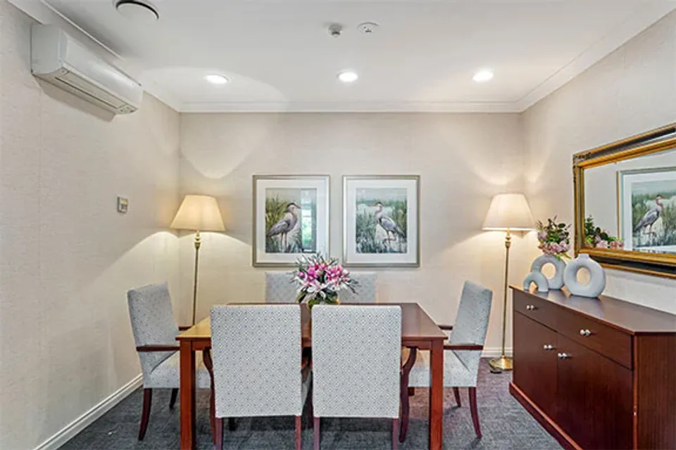Small dining room with a table and sideboard