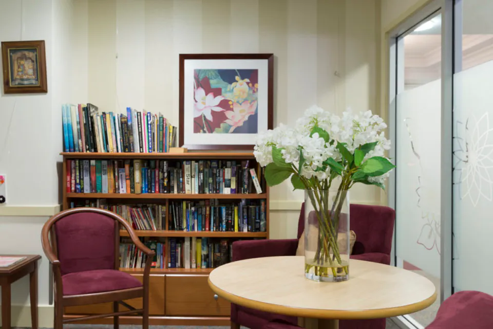 Reading area with bookshelves and round table