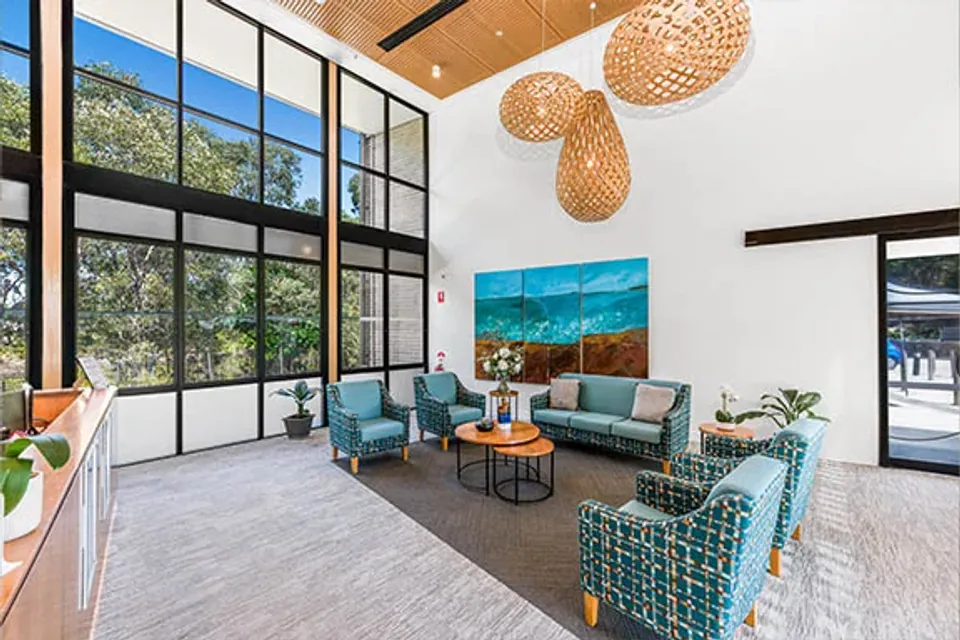 Lounge with tall windows and chairs