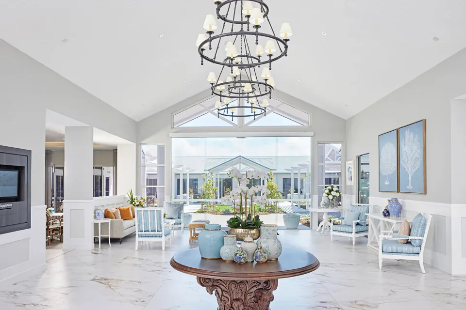 Entrance lounge with chandelier and garden view