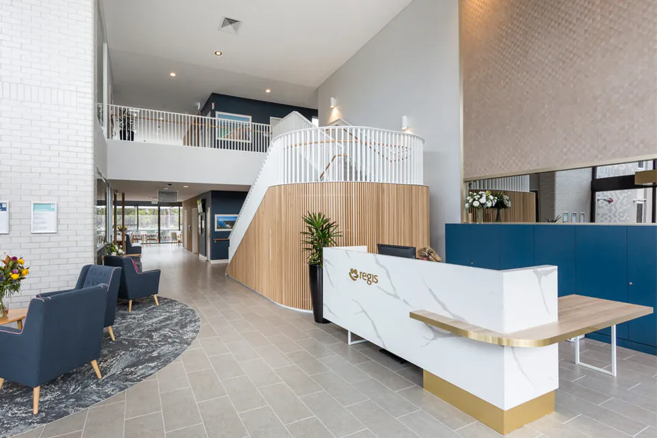 Reception desk in a high-ceilinged entrance hall