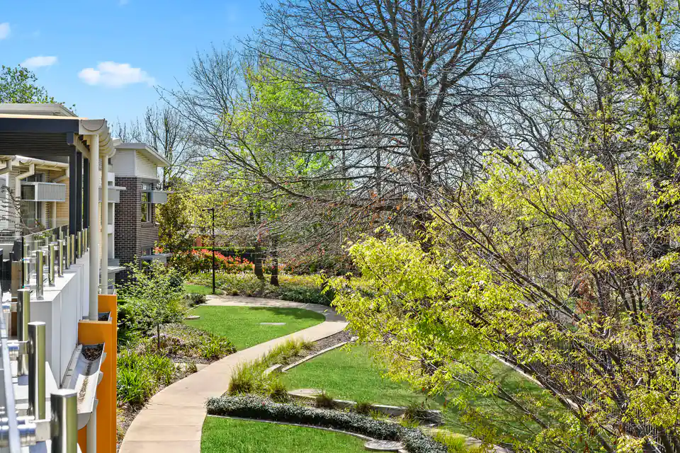 Landscaped garden and curved path beside the residence