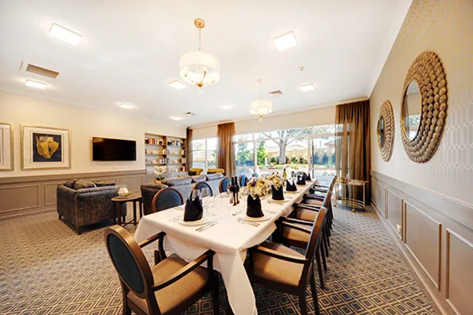 Long formal dining table set for a meal
