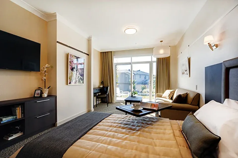 Lounge seating beside a balcony window