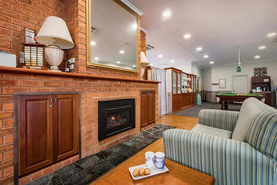 Fireplace and armchairs in a lounge