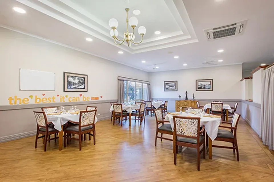 Dining room with tables set for meals