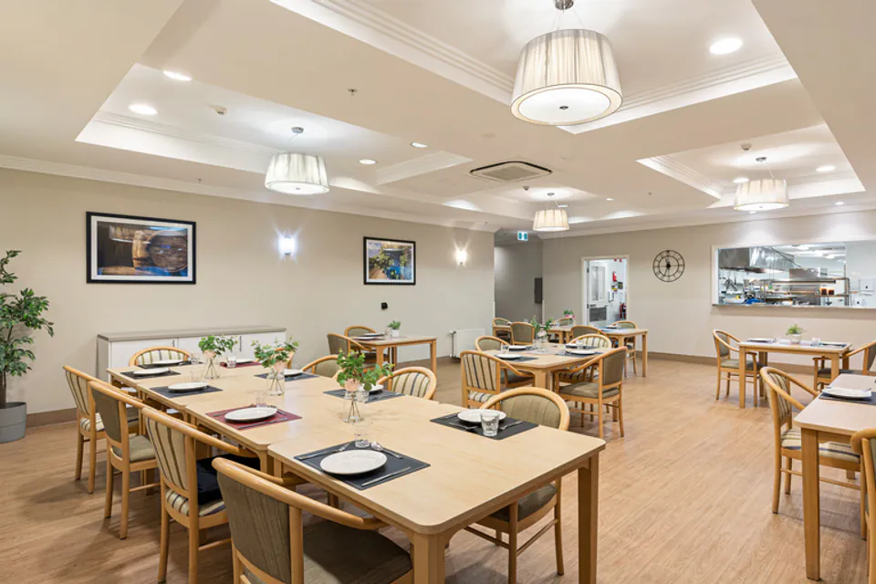Dining room with tables beneath pendant lights