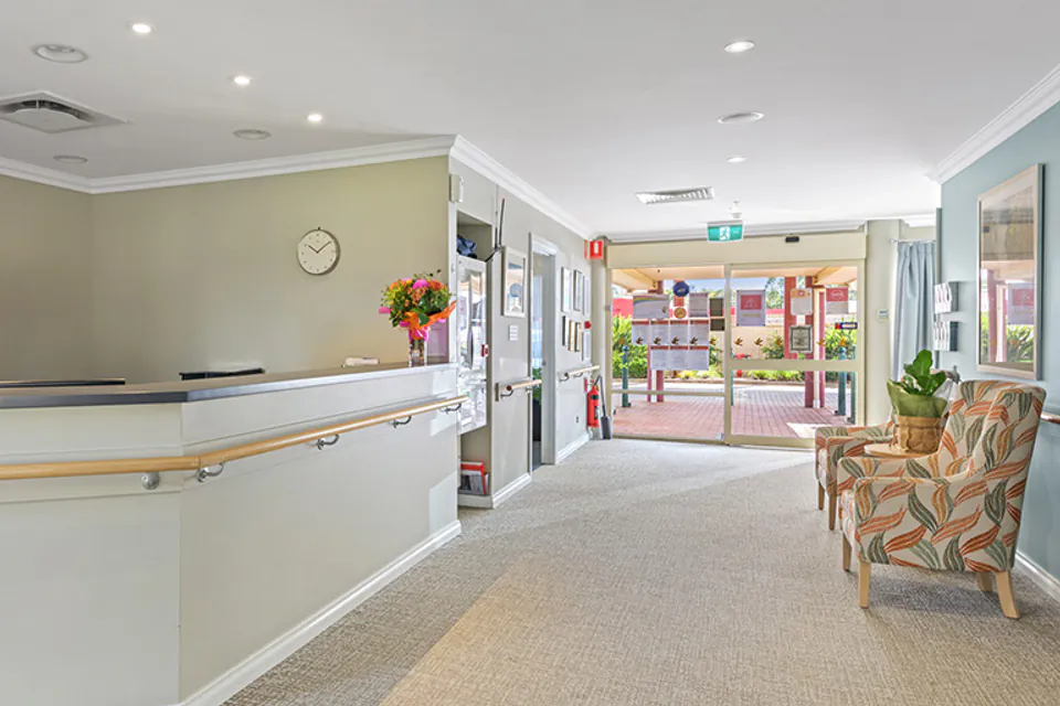Reception counter beside glass entrance doors