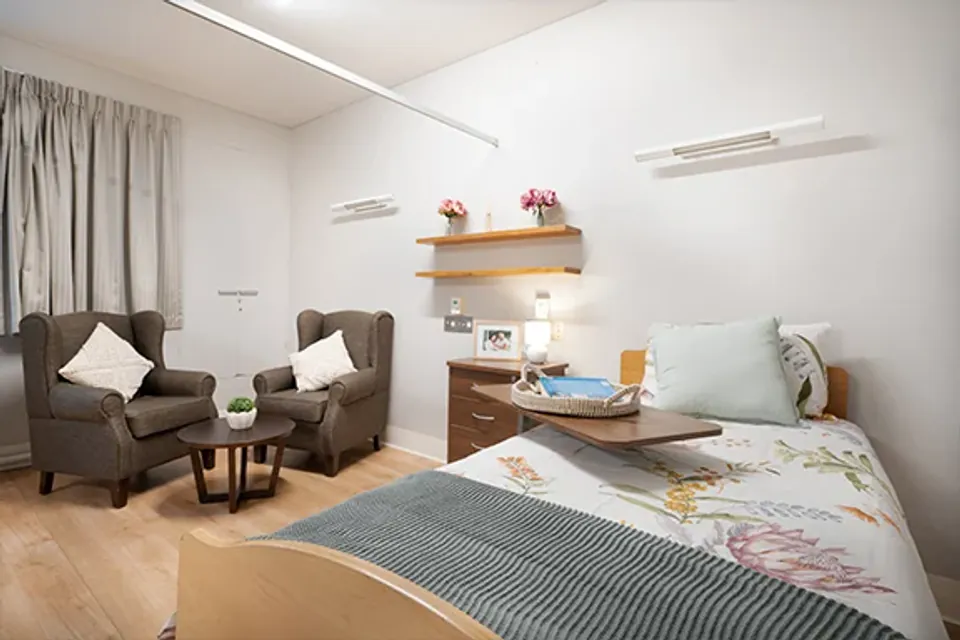 Single bedroom with two armchairs